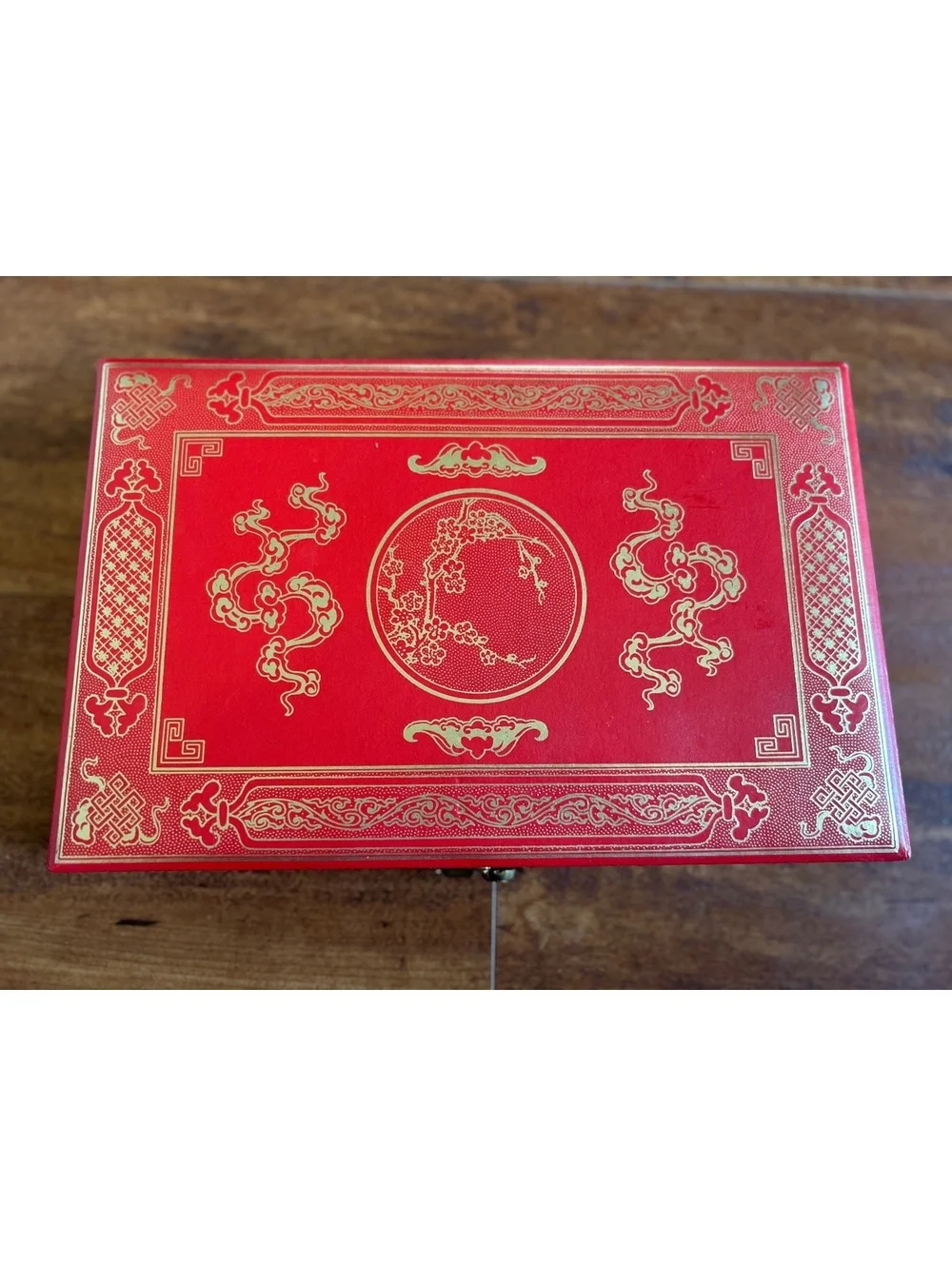 Vintage Red Jewelry Box with Gold Embossed Design and Multiple Compartments
